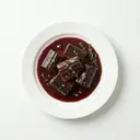 Aal in Rotwein mariniert, pochiert