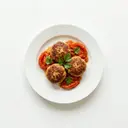 Frikadellen gebraten, mit gedünsteten Tomaten