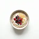 Frischkornbrei gesüßt, mit Joghurt 3,5 % Fett und Fruchtmischung