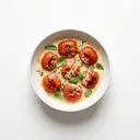 Ganze Tomaten gedünstet, mit Sahne