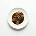 Kalbsbrust gedünstet, mit Grundsauce dunkel/braun