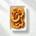 Kürbis gebacken, in Grundsauce hell/weiß mit Sahne