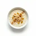 Milchreispudding mit Mandeln und Sultaninen